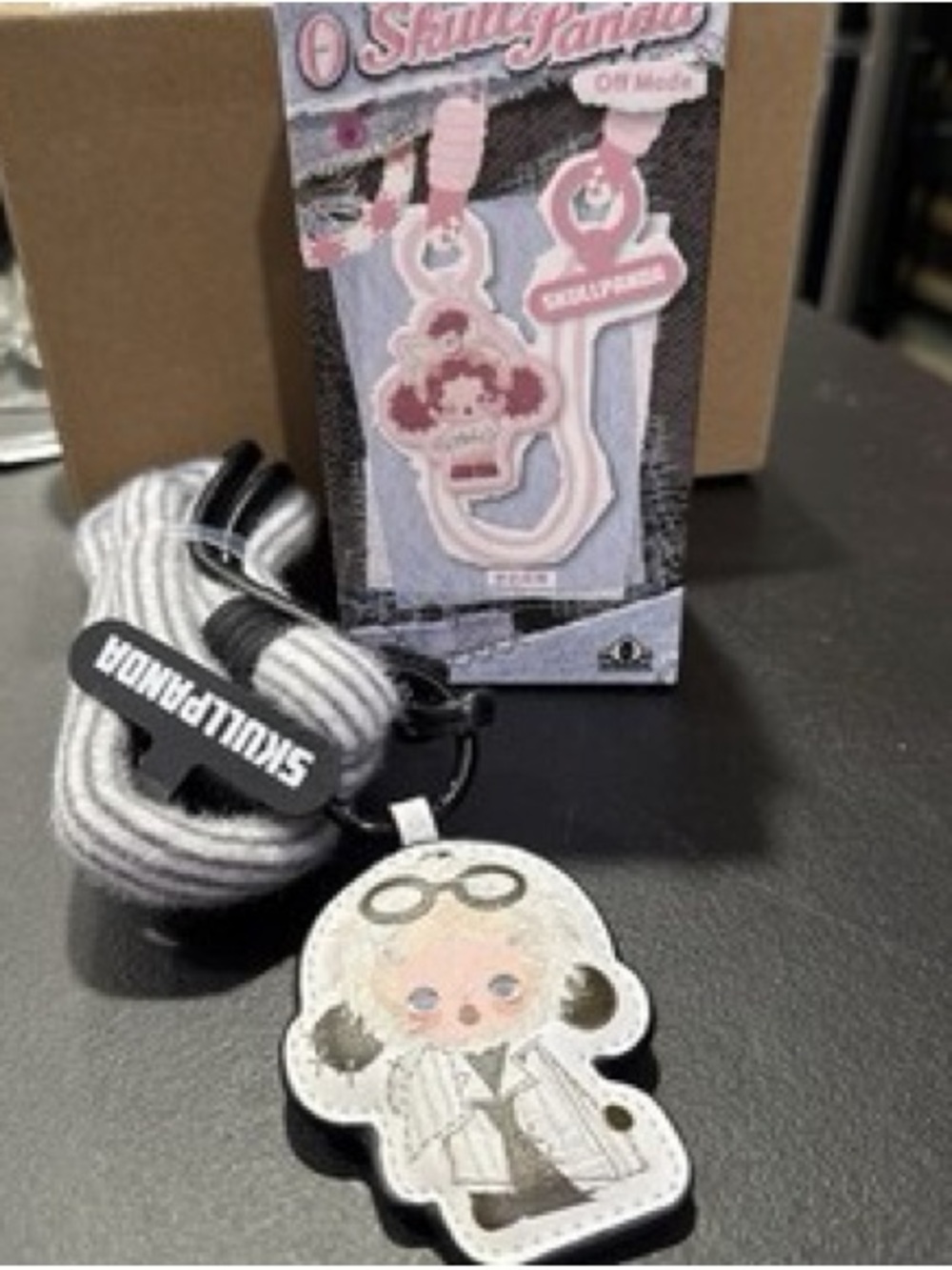 SKULLPANDA “no Adulting" phone lanyard from the POP MART Off Mode Series.